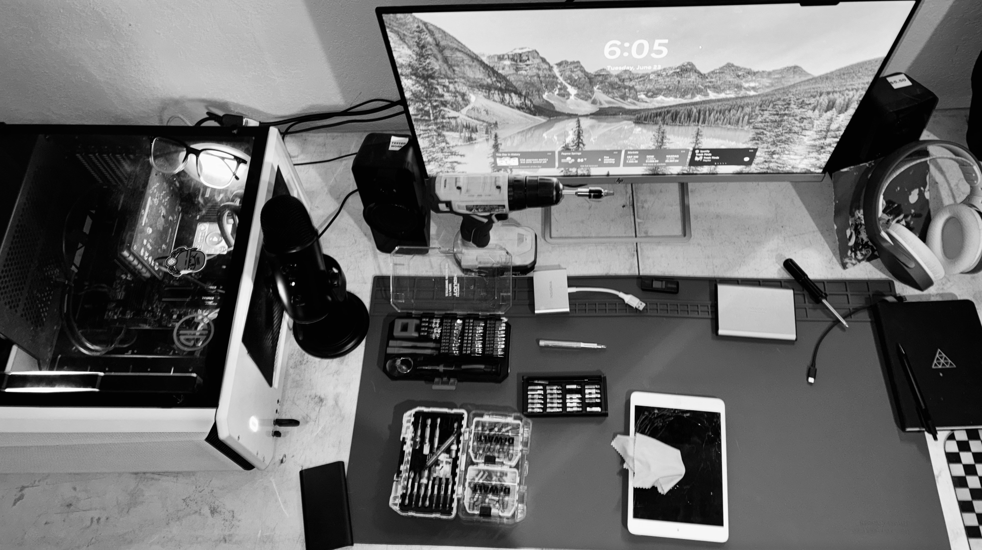 Veritas technology repair workspace with computer, tools and device-repair equipment